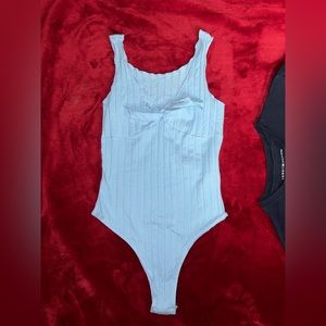 Blue ribbed bodysuit with bow